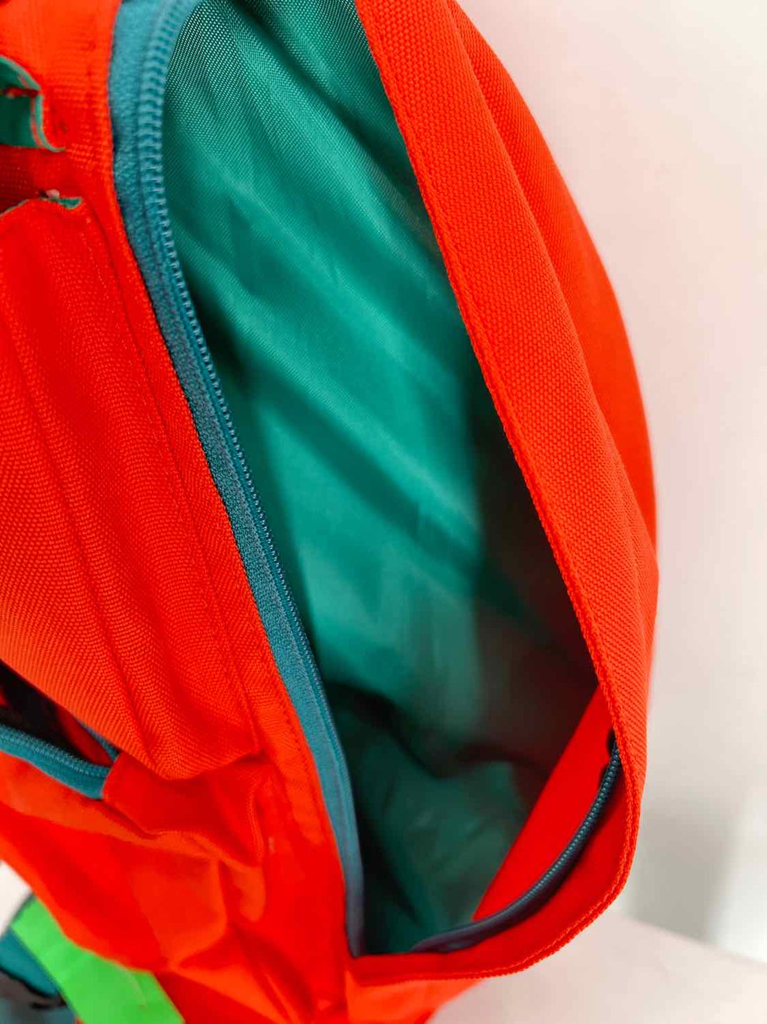 Kavu Orange & Teal Sling Backpack